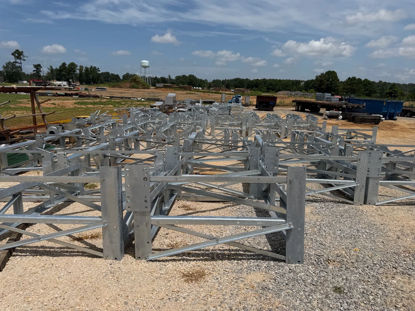 Hot-dip galvanized substation steel frames with drilled bolt patterns staged in the FabTek Industries yard in Hazlehurst, Mississippi