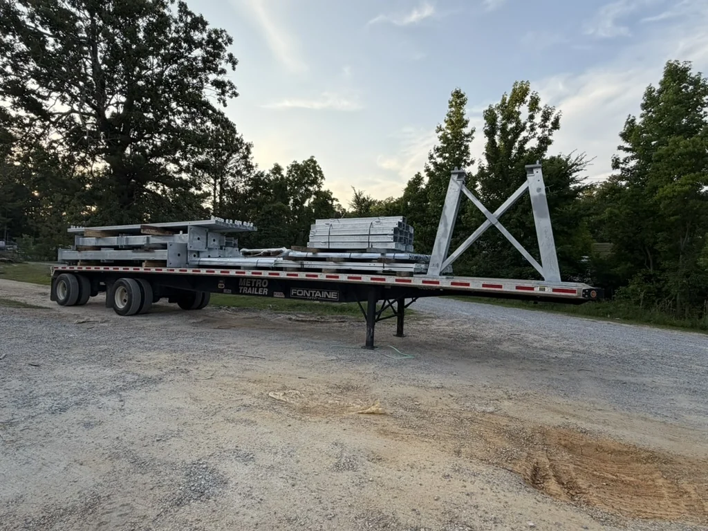 Hot-dip galvanized substation structures and A-frame loaded on a flatbed trailer for shipment from FabTek Industries, Hazlehurst, Mississippi