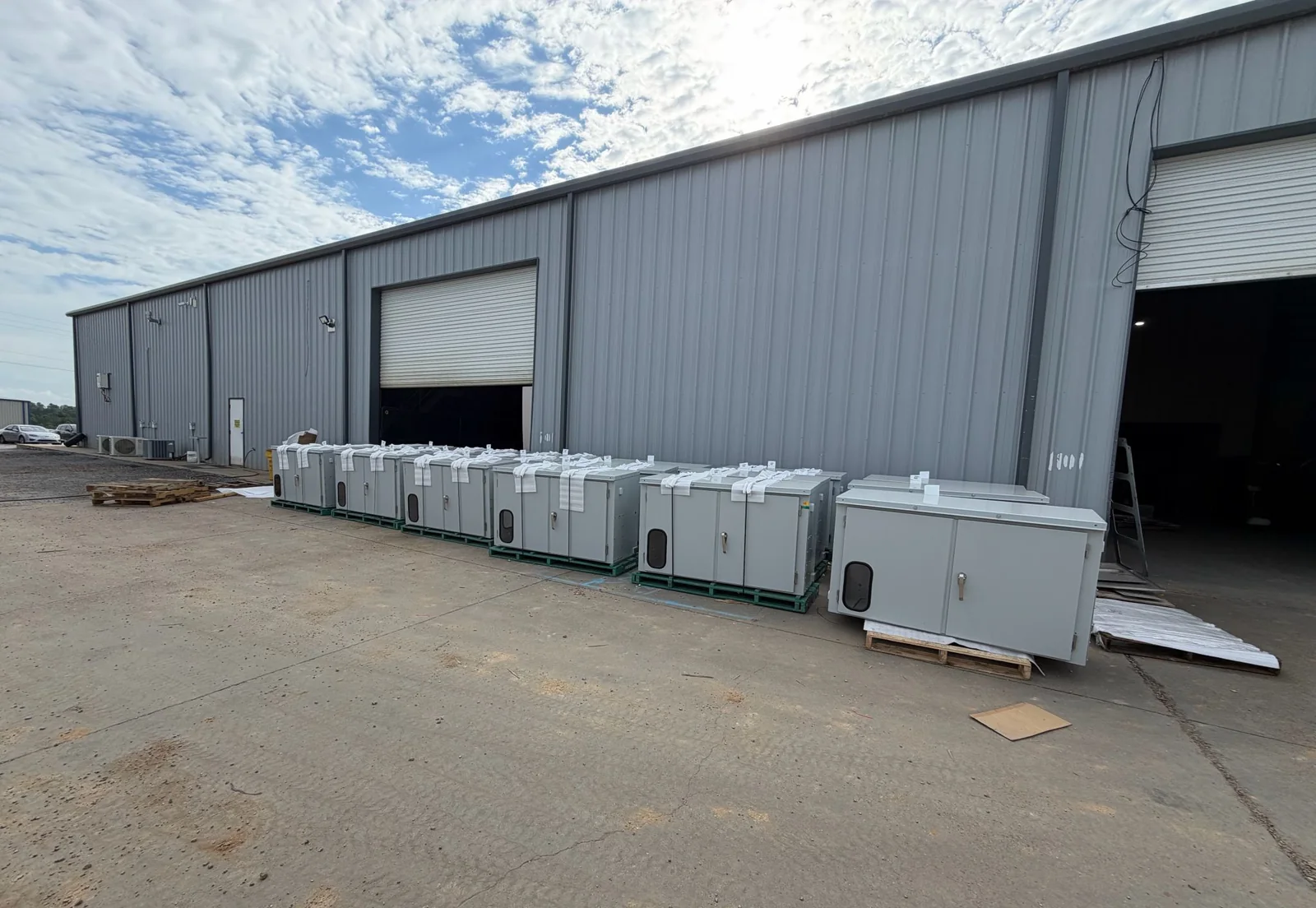 Finished pad-mount transformer cabinets wrapped and staged for shipment to a transformer OEM outside the FabTek Industries plant in Hazlehurst, Mississippi